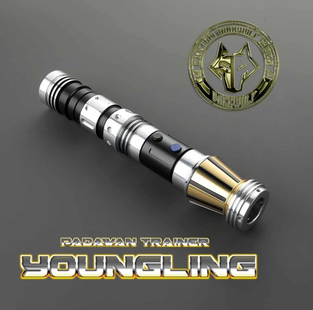 A sleek, futuristic lightsaber with gold and black accents.