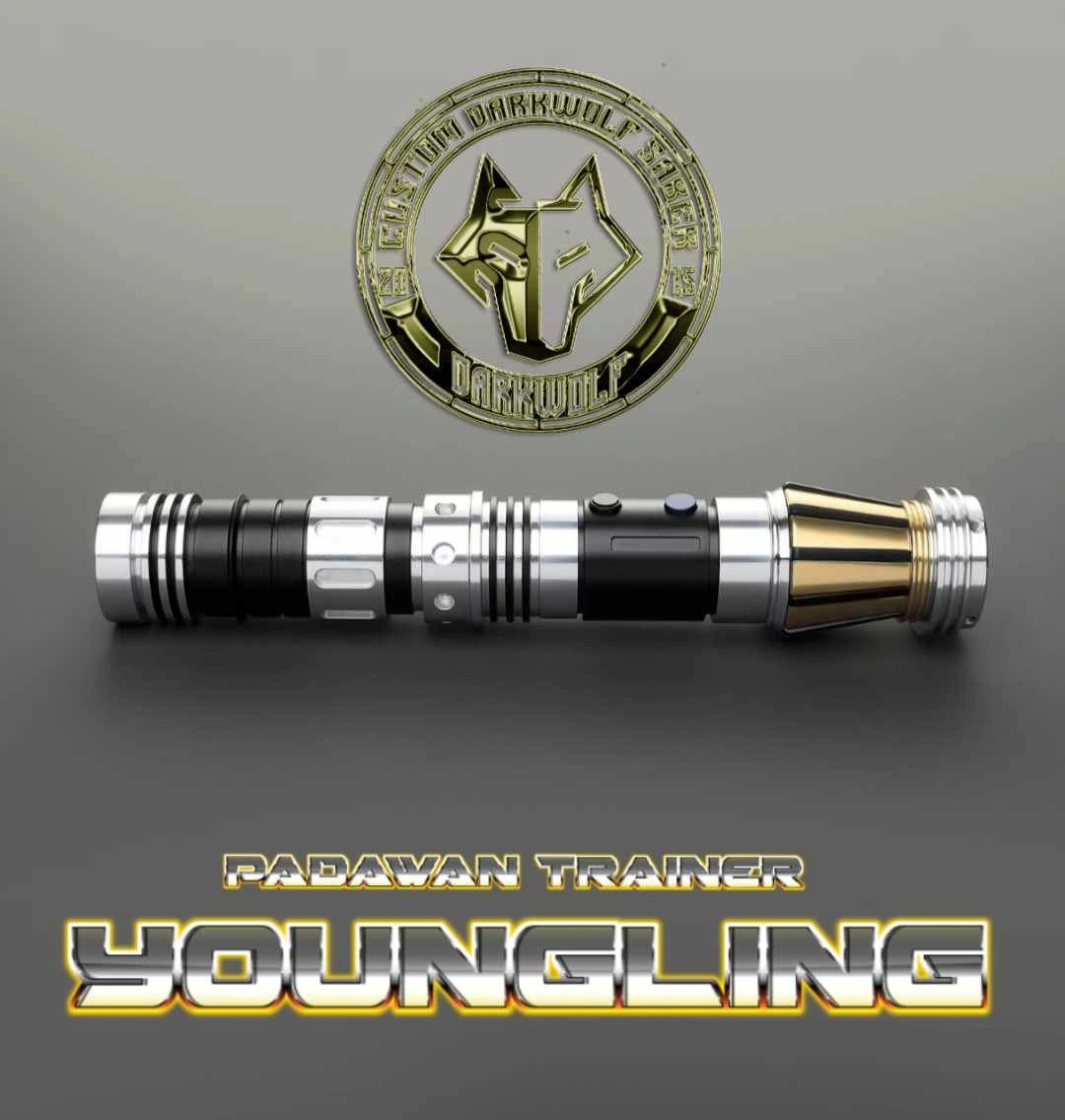 A sleek, metallic vaping device with a gold tip and logo badge behind it.