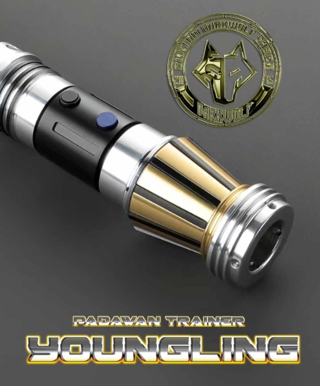 Close-up of a custom lightsaber hilt with metallic and gold accents.