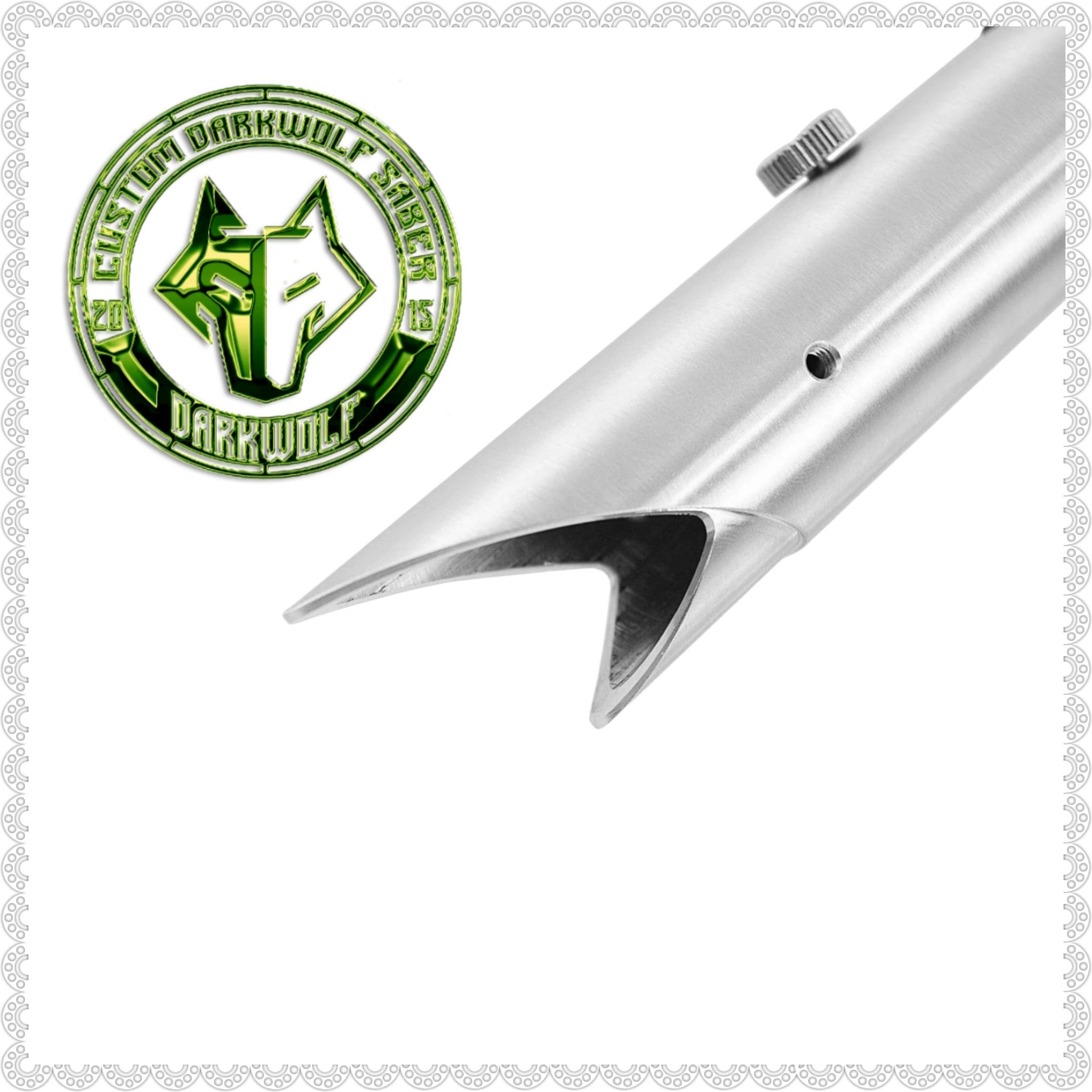 Close-up of a sharp, angled metal blade with a logo beside it.