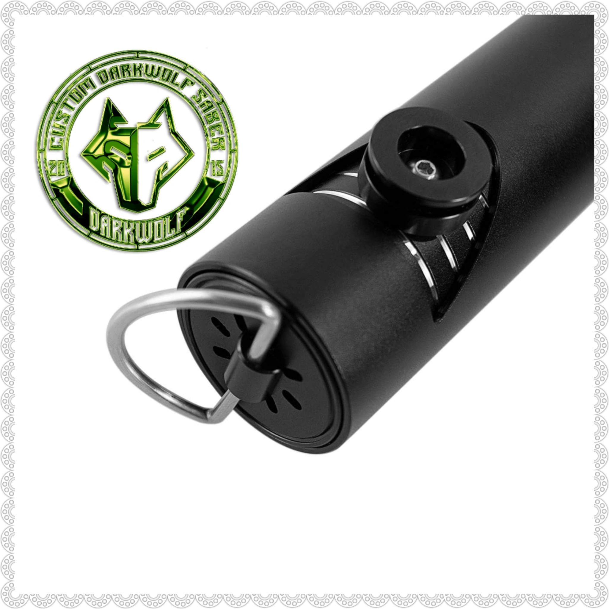 Close-up of a black cylindrical tactical gear with a metal ring attached.