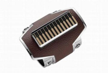 A brown and silver electronic device with multiple buttons.