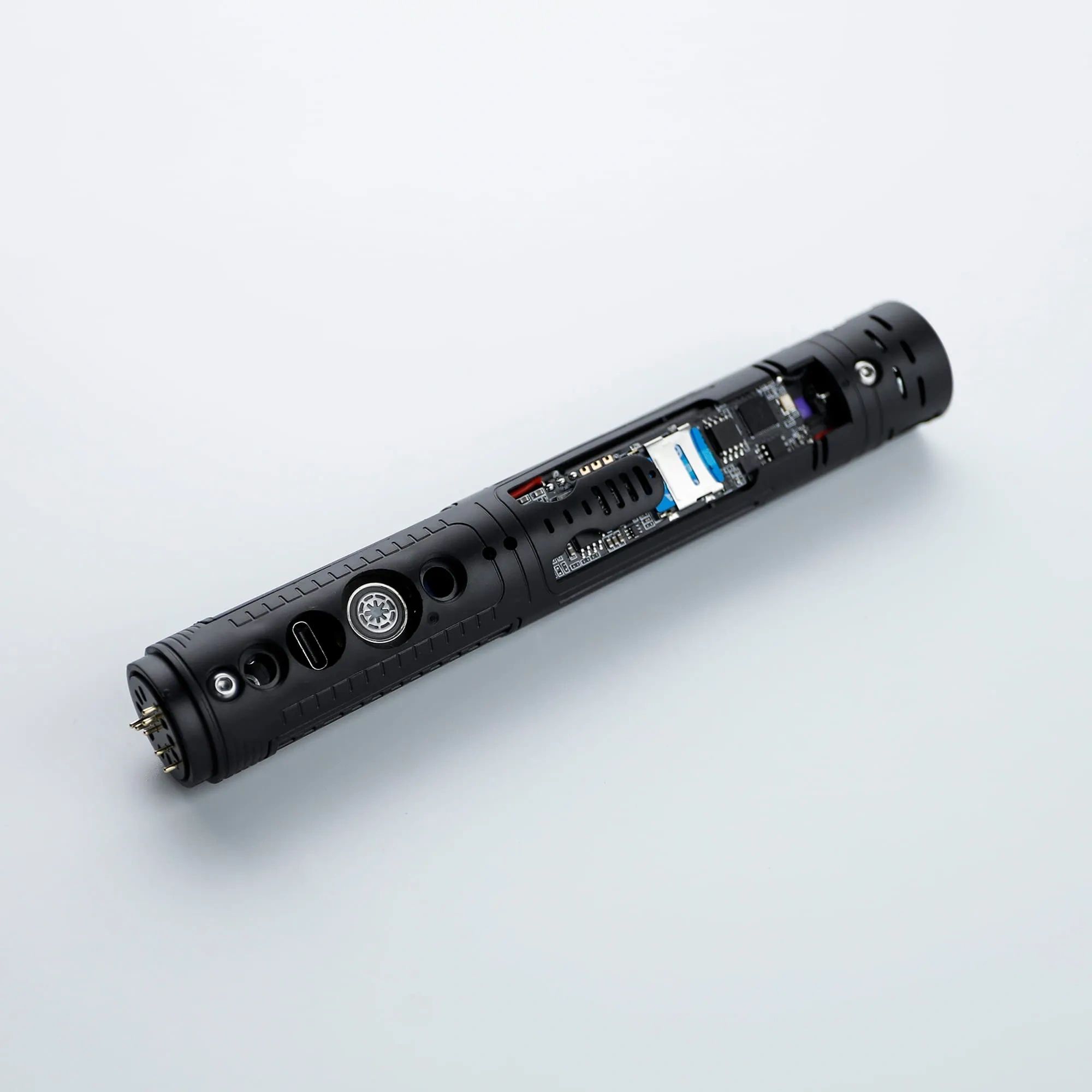 Black portable flashlight with a button and a display screen.