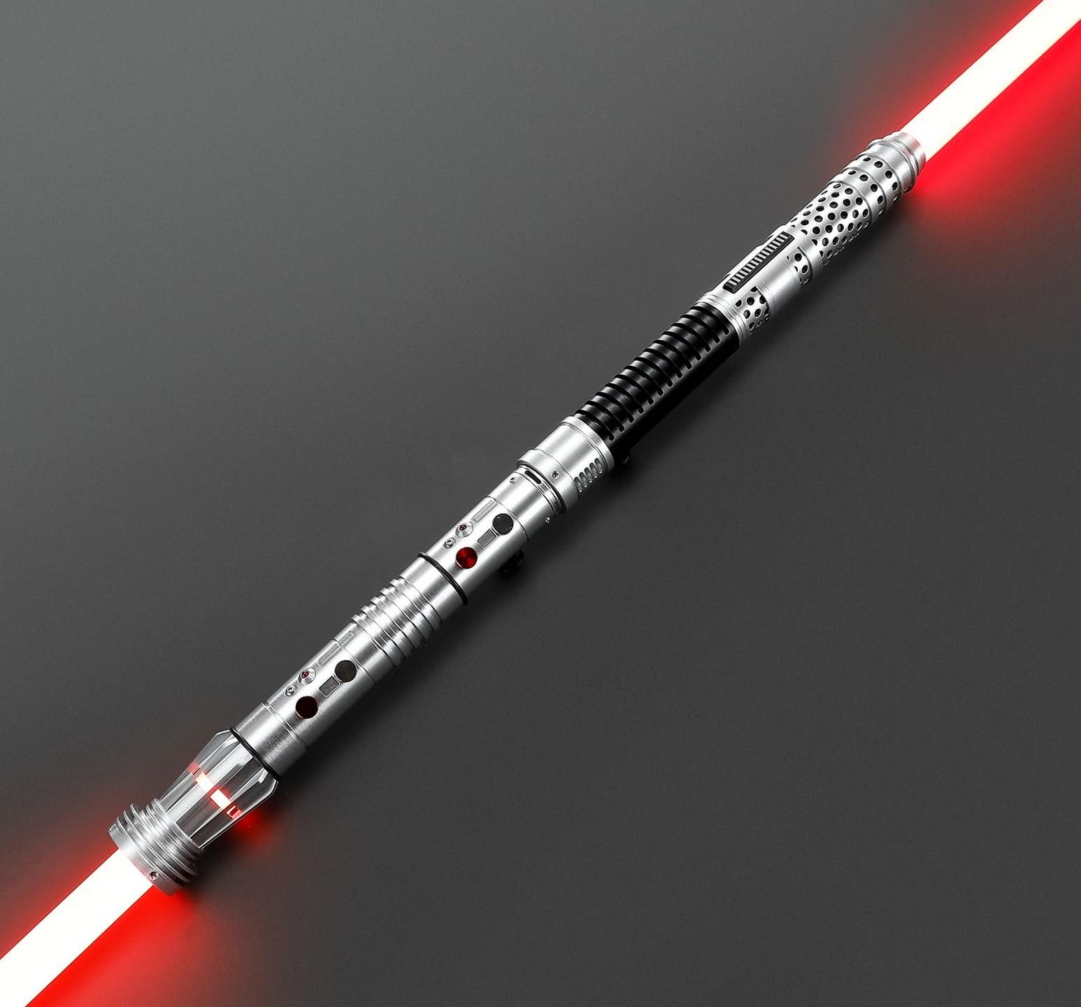 A red lightsaber with a silver and black hilt glowing brightly.