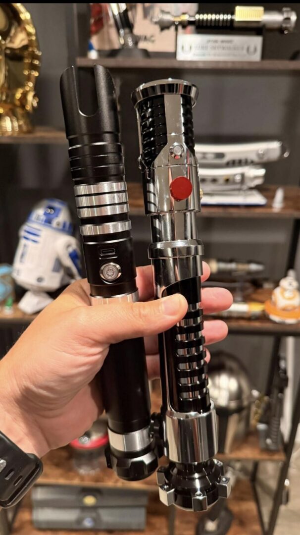 DarkWolfSabers customer Bryan Shelley holding two lightsaber hilts
