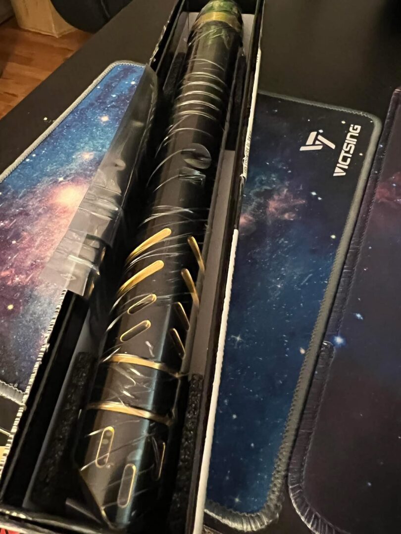 DarkWolfSabers customer Will Windsor black and gold lightsaber in presentation case